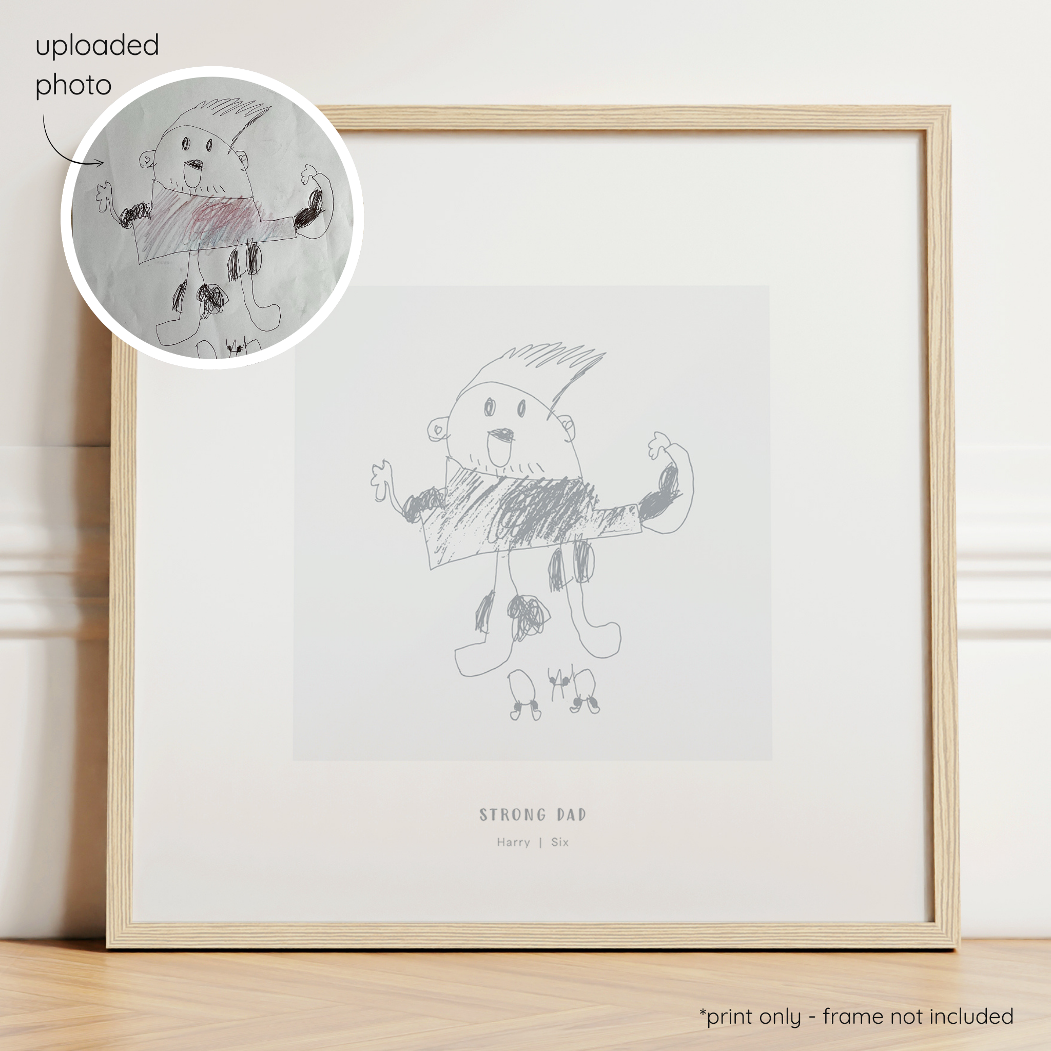 Framed dark grey abstract line art print of a child's drawing on a light grey background with a close-up inset of the original drawing.